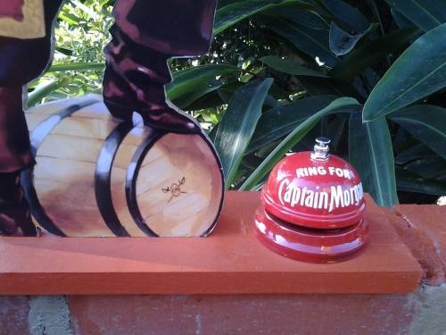captain morgan standing sign and bell